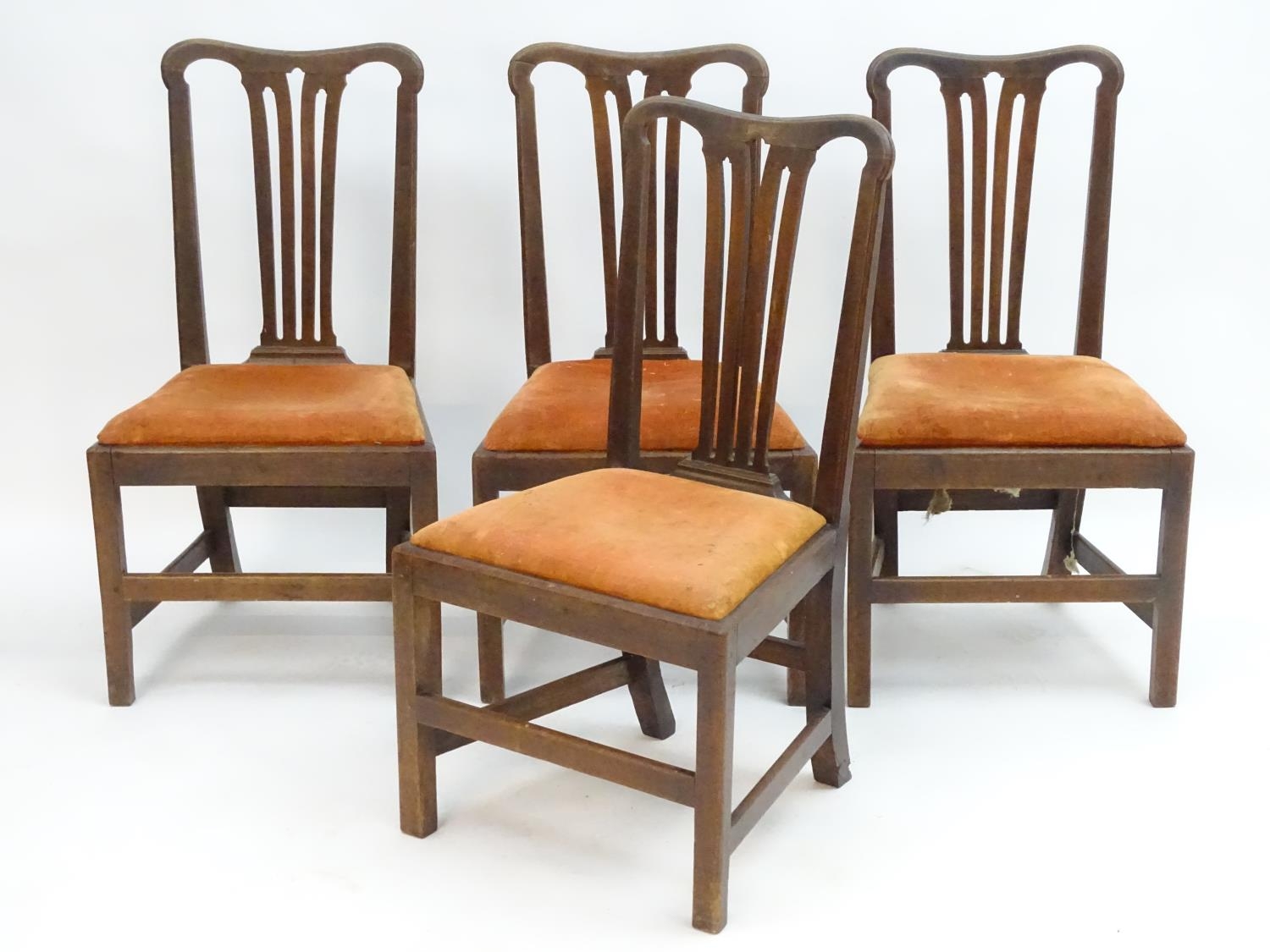 Four mahogany Chippendale side chairs with shaped top rails and pierced fanned back splats above