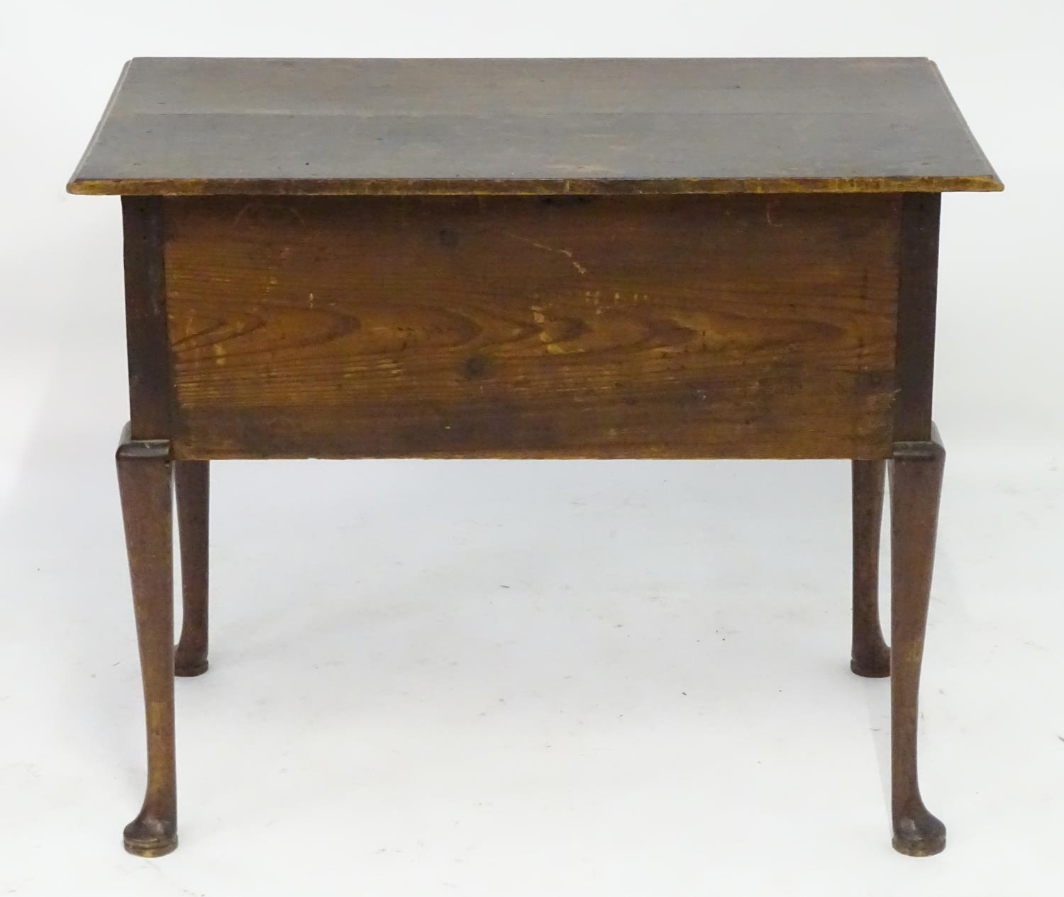A mid 18thc oak lowboy with a moulded rectangular top above a single long and two short drawers with - Image 4 of 5