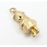 A 9ct gold novelty pendant charm formed as a WWI / WW1 / World War One soldier. Approx. 1" Please