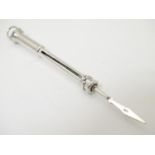 A silver retractable toothpick. marked 925. Approx. 2" long (closed) Please Note - we do not make