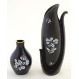 A Wade vase with floral detail, together with a Burleigh Ware style shaped vase with flower