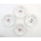 Four Continental moulded and hand painted plates decorated with flowers and insects with gilt