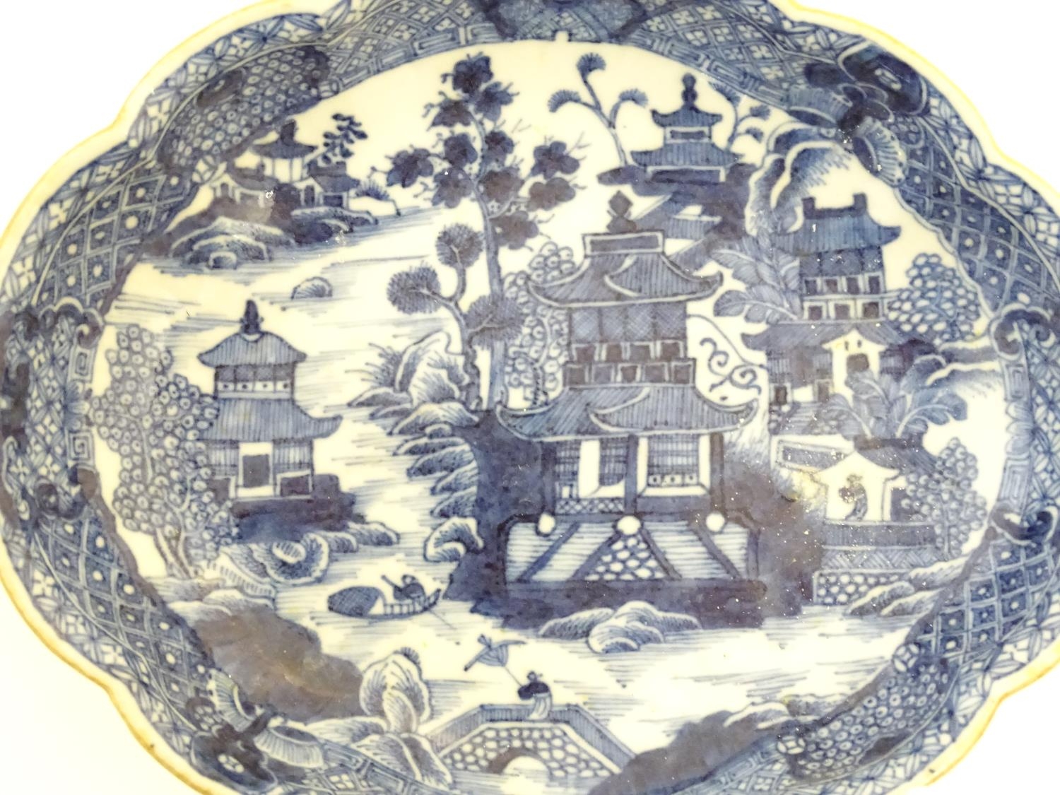 An Oriental blue and white plate with stylised peony detail, and stylised scrolling flower motifs to - Image 6 of 8