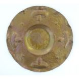 An Arts & Crafts hammered copper tray of circular form with mushroom / fungi detail in the Newlyn