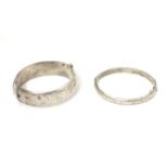 Two silver bracelets of bangle form, one hallmarked Birmingham 1972, maker MM, the other