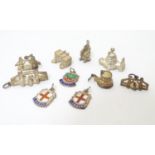 A quantity of assorted silver plate and silver pendant charms, to include models of British