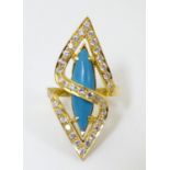 A 22ct gold dress ring set with central turquoise with diamond detail. Please Note - we do not