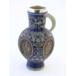 A 19thC German salt glazed stoneware jug by Merkelbach & Wick, with a silver rim hallmarked