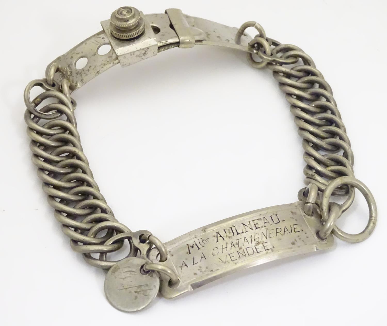 A French silver plate dog collar with chain links, adjustable clasp and engraved owner plaque.