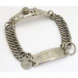 A French silver plate dog collar with chain links, adjustable clasp and engraved owner plaque.