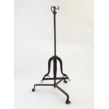 An 18thC fireside ' lark spit ' meat roasting stand, of hand forged wrought iron construction,