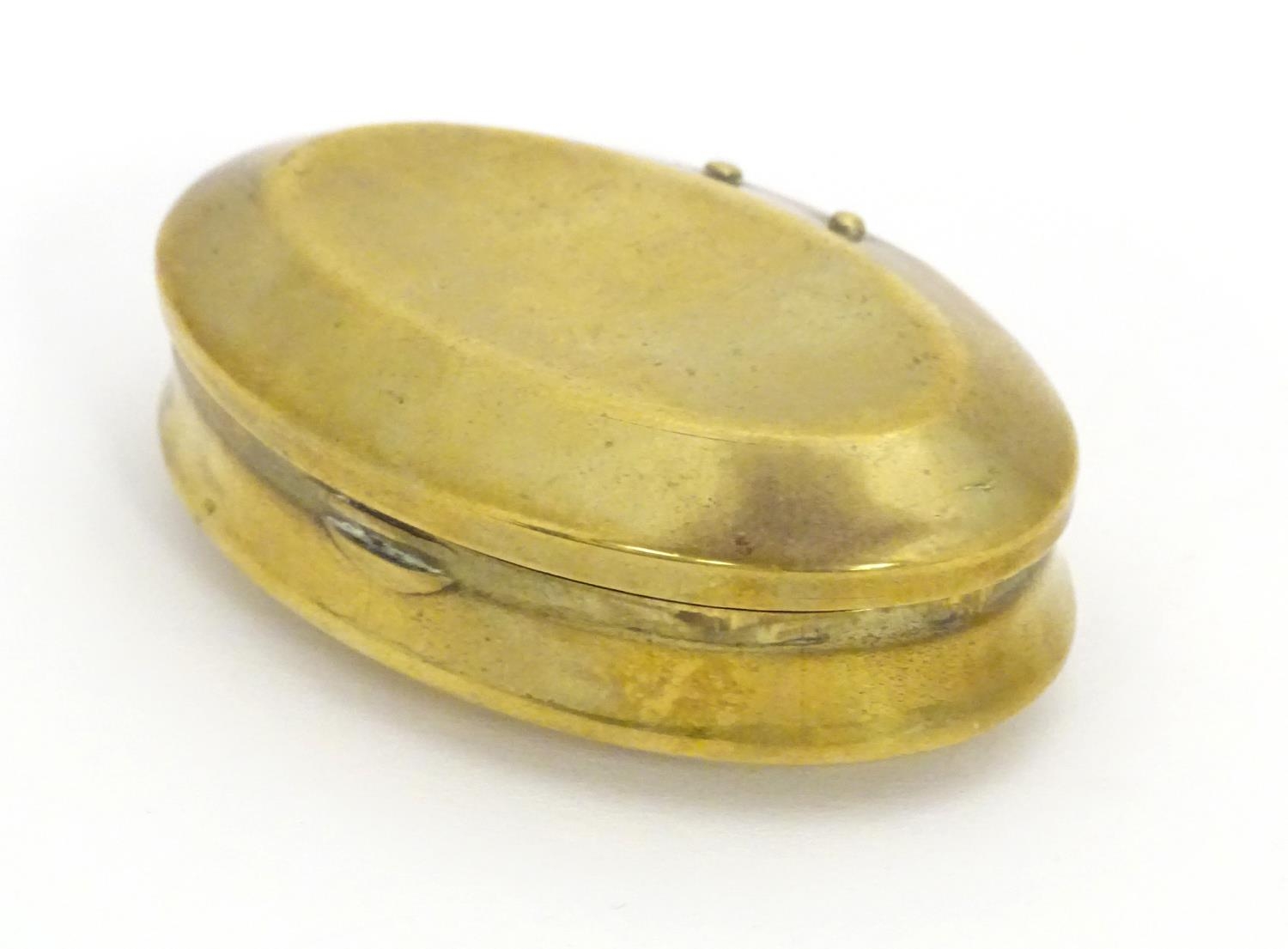 A Victorian brass snuff box of oval form, marked under Solid Brass. Approx. 1 3/4" x 2 3/4" Please - Image 8 of 16