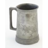 A mid 20thC pewter tankard by Swatow Weng Lee Co, Hong Kong, decorated with Chinese Loong dragon and