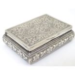 A white metal pill box with floral decoration. Approx. 2 1/2" wide Please Note - we do not make