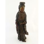 A Chinese carved wooden female deity sculpture with traces of polychrome decoration, possibly Guan