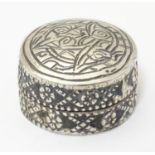 An Egyptian silver pill box of circular form. Approx. 1" diameter Please Note - we do not make
