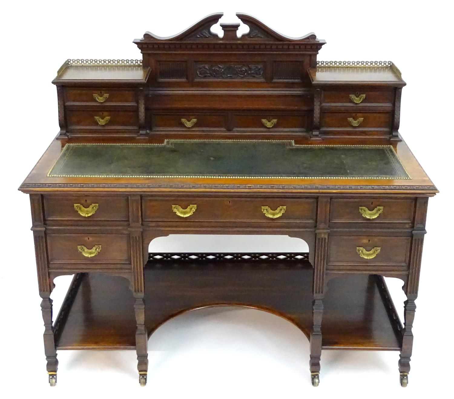 A late 19thC / early 20thC walnut Shoolbred desk with a carved back stand and a pierced brass - Image 4 of 13