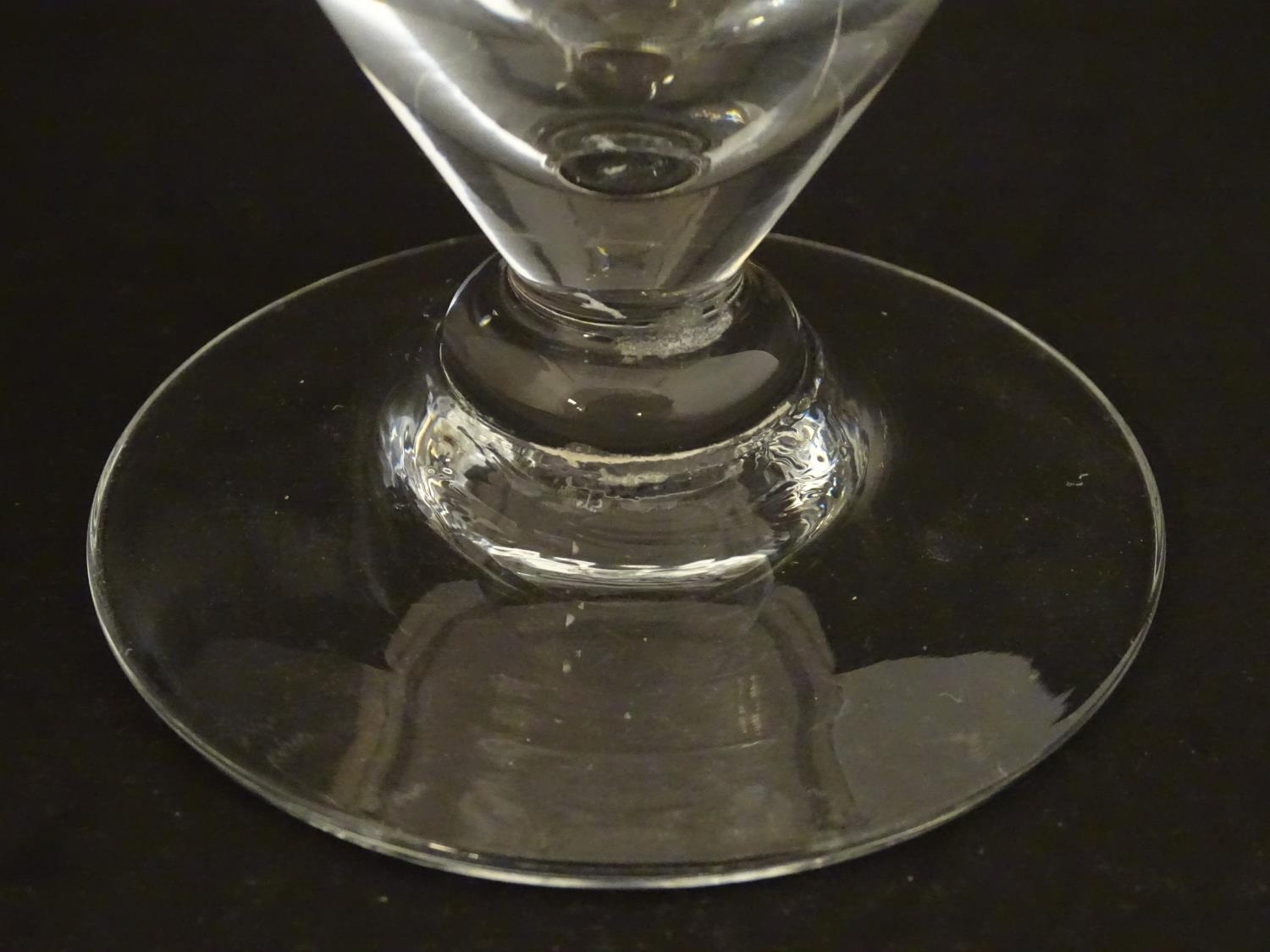 A drinking glass with wide foot. 4 1/2" high Please Note - we do not make reference to the condition - Image 5 of 5