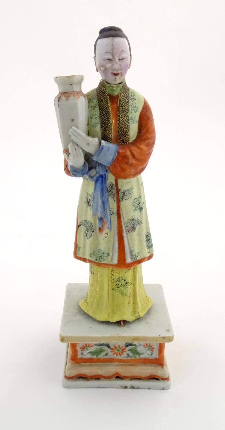 An Oriental porcelain model of a male figure wearing a kimono with butterfly and floral detail - Image 2 of 8