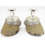 A pair of Victorian horse hoof formed candlesticks with silver plated mounts, engraved ' Whiskey