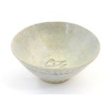 An Oriental earthenware bowl of tapering form with brushwork detail. Approx. 2 1/4" high x 5"