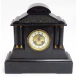 A Victorian black slate cased mantel clock of architectural form with column decoration, the