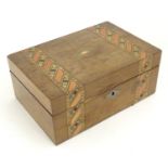 An early 20thC walnut work box with inlaid stained geometric detail. Approx. 4 1/4" x 10" Please