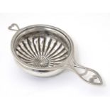 An American sterling silver tea / lemon strainer. Approx. 4 1/4" long Please Note - we do not make