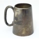 A silver christening mug with loop handle, hallmarked Birmingham 1930, maker Wilmot Manufacturing