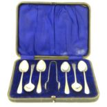 A cased set of 6 silver teaspoons with sugar tongs en suite, Hallmarked Sheffield 1918 maker John