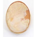A 9ct brooch set with classical cameo. 1 1/2" long Please Note - we do not make reference to the