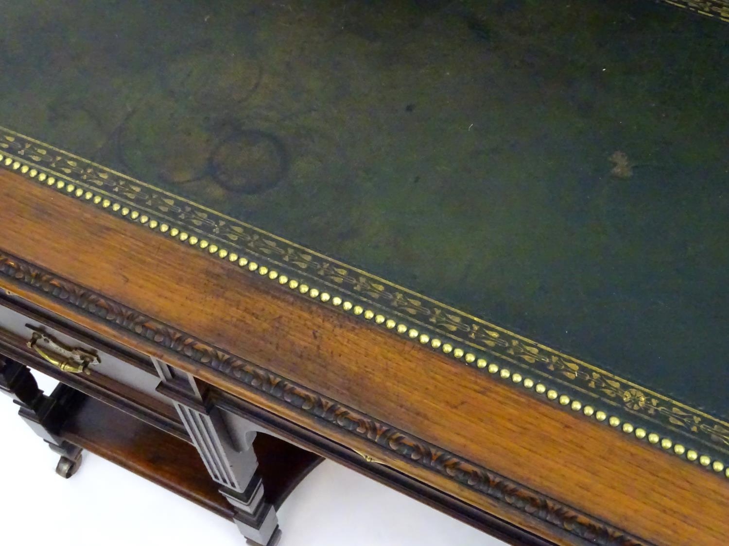 A late 19thC / early 20thC walnut Shoolbred desk with a carved back stand and a pierced brass - Image 10 of 13