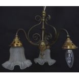 An early 20thC pendant three branch ceiling light , the brass mount with scroll decoration,