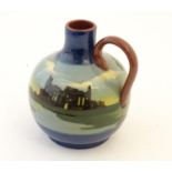 A Torquay Longpark bottle vase with a single handle, the body decorated with a landscape view of