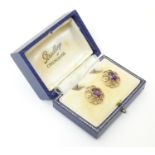 A pair of 9ct gold amethyst earrings. Approx. 3/4" long Please Note - we do not make reference to