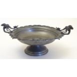 A 20thC Continental pewter pedestal bowl with a lobed edge, central scrolling detail and twin
