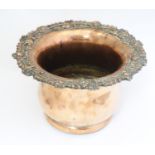 A silver plate wine bottle coaster / champagne bucket with turned wooden base. 5 1/2" high Please