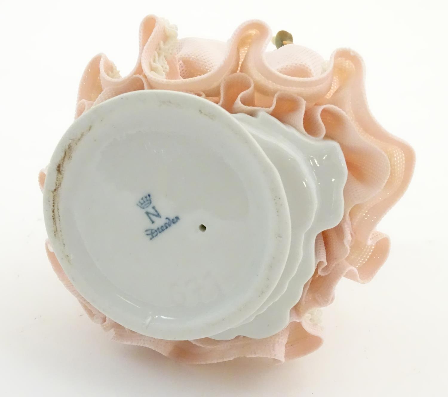 A Dresden model of a lady with a porcelain lace dress. Marked under. Approx. 5 3/4" high Please Note - Image 6 of 6