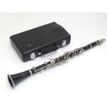 A mid to late 20thC Bb Clarinet by Buffet Crampon, Paris, model B12, stamped with maker's emblem and