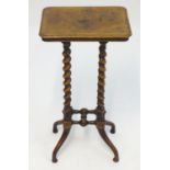 A 19thC walnut wine table with a crossbanded top and moulded edge above four barley twist supports