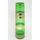 A mid 20thC Borske Sklo Czechoslovakian art glass green vase, decorated with white and gold bands,
