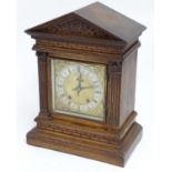 A late 19thC / early 20thC German walnut cased mantel clock by Winterhalder & Hofmeier,