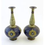 A pair of large Royal Doulton stoneware vases with floral decoration. Marked under, pattern no.