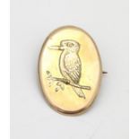 A gilt metal brooch with embossed kingfisher bird detail. Approx. 1 1/4" long Please Note - we do
