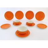 A quantity of retro Crown Ducal wares with an orange glaze to include tea cups, saucers and