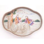 A Chinese export dish of quatrefoil form depicting a landscape scene with a man playing a horn