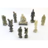 A quantity of Oriental carved soapstone figures to include Guan Yin, sage / elder figures, scholars,