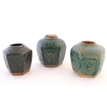 Three Chinese hexagonal Shiwan ginger jars / vases with moulded floral and foliate detail with a