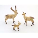 Three Beswick deer comprising Standing Stag, model no. 981, Doe, no. 999A and Fawn, no. 1000B.