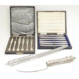 Two cased sets of silver plate tea/dessert knives. Together with a cake knife and pie server with